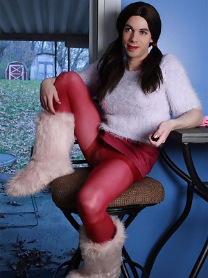 Crossdresser in fuzzy boots with a big purple toy